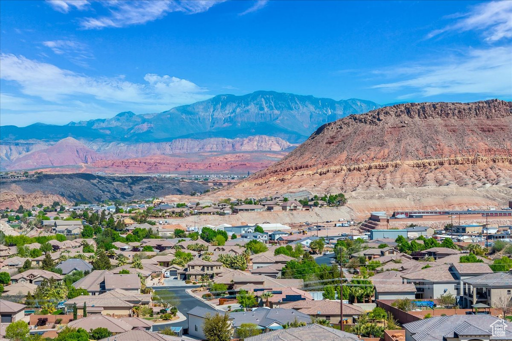 View of mountain backdrop featuring nearby suburban area
