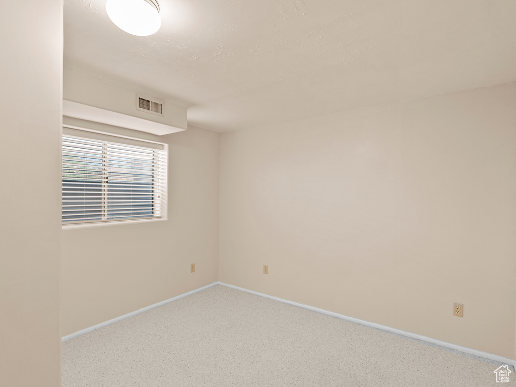 Unfurnished room with baseboards and carpet floors