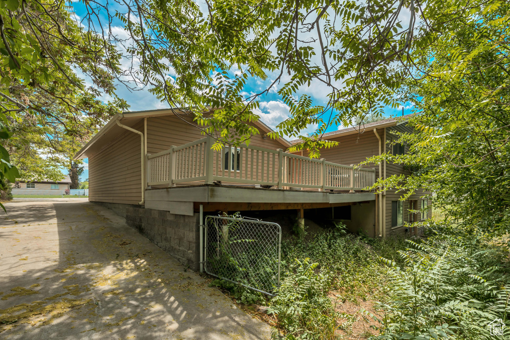 Back of property with a deck