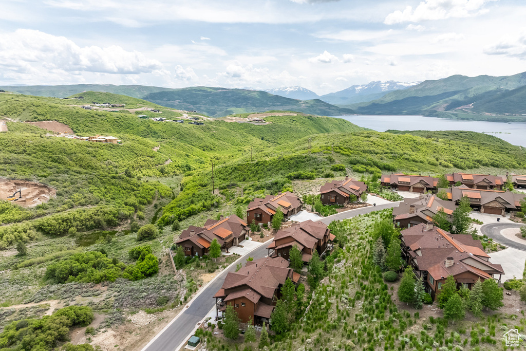 Aerial perspective of suburban area featuring a water and mountain view