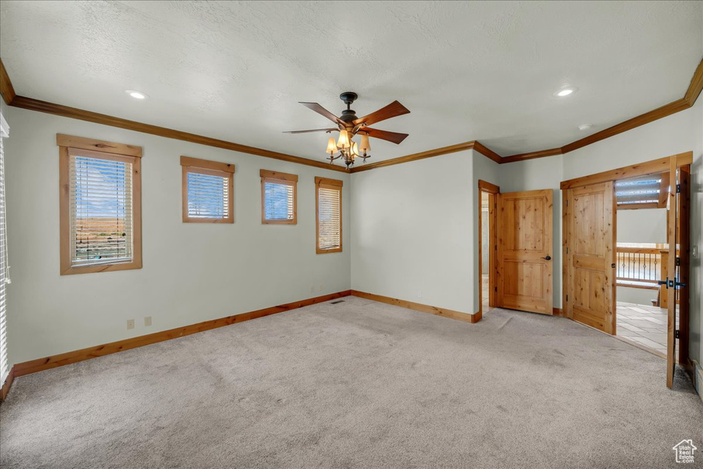 Unfurnished bedroom with carpet, ornamental molding, recessed lighting, and a ceiling fan