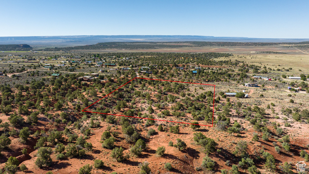 Overview of rural landscape featuring property boundaries highlighted and mountains