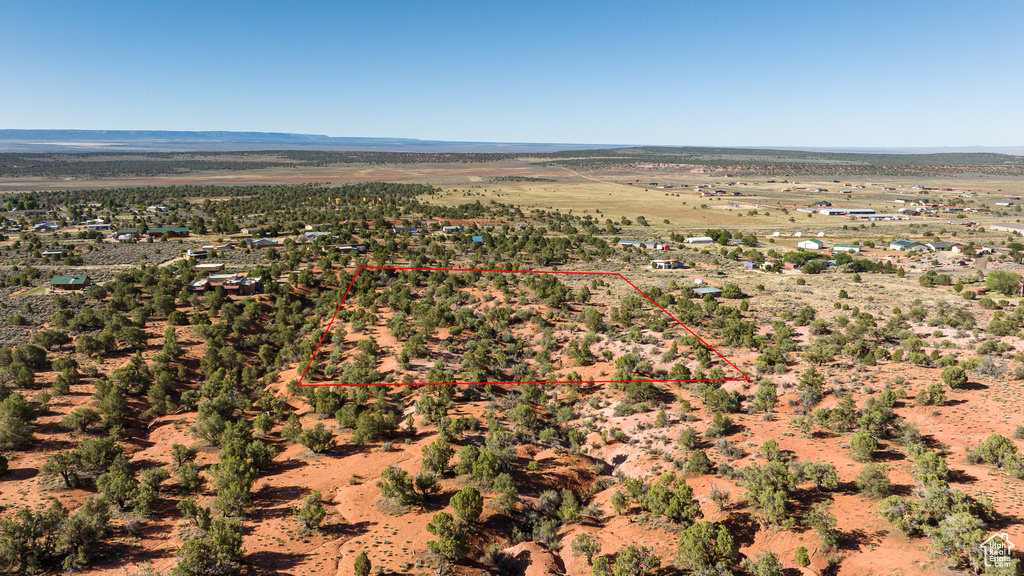 Overview of rural landscape featuring property parcel outlined and mountains