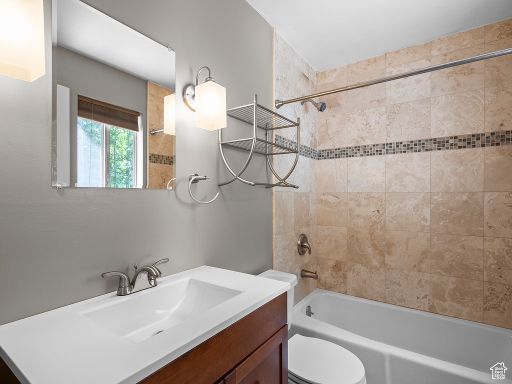 Full bathroom with vanity and bathing tub / shower combination