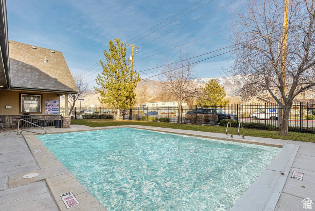 Community pool featuring a patio area
