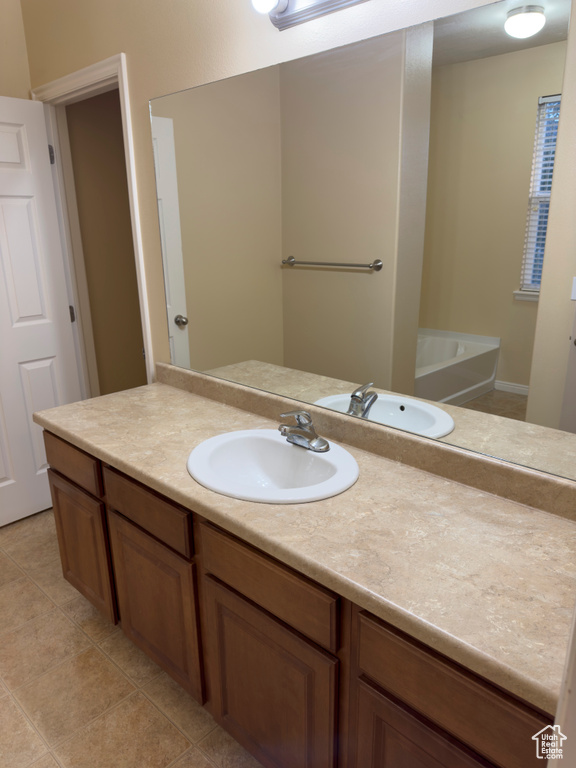 Bathroom featuring vanity and tile patterned flooring