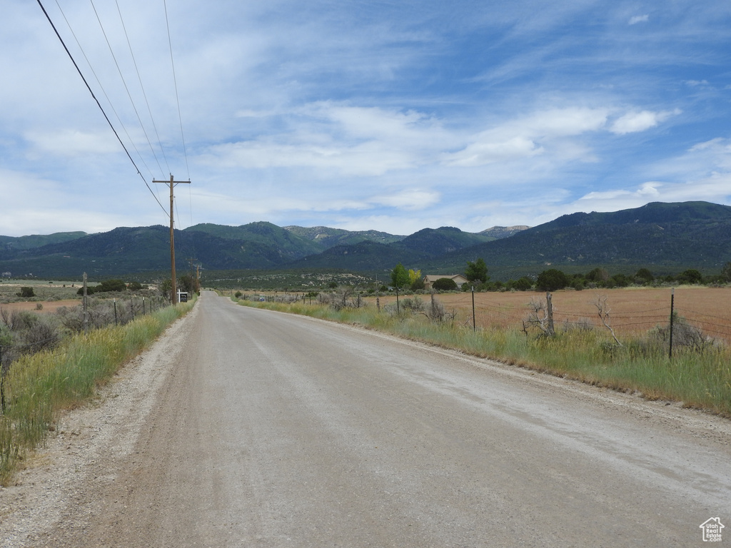 View of road with a mountain view and a view of rural / pastoral area
