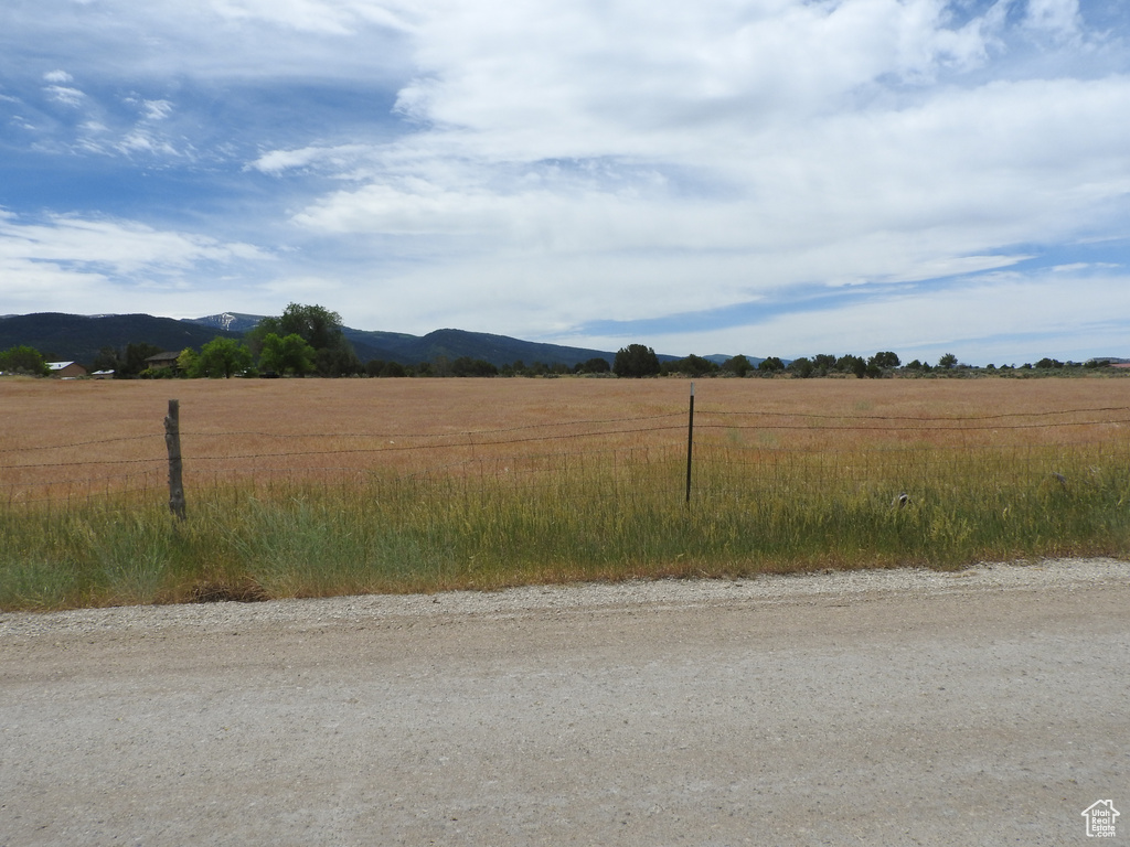 View of mountain backdrop featuring rural landscape