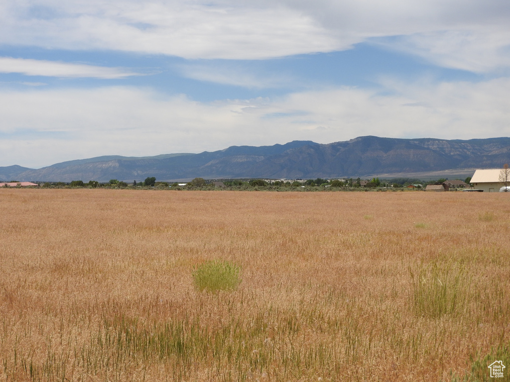 View of mountain backdrop with rural landscape