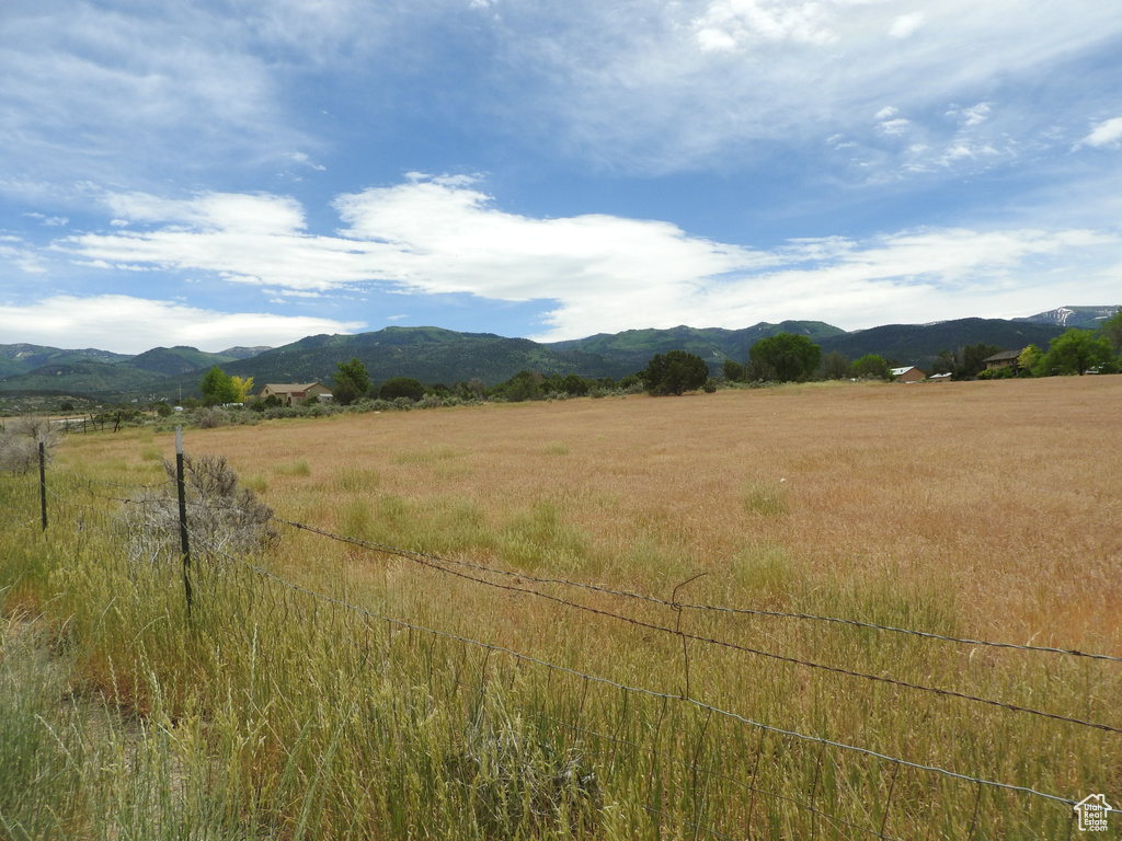 View of mountain backdrop featuring rural landscape