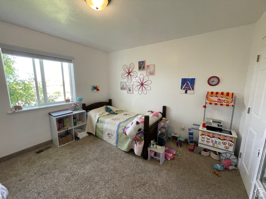Bedroom featuring carpet
