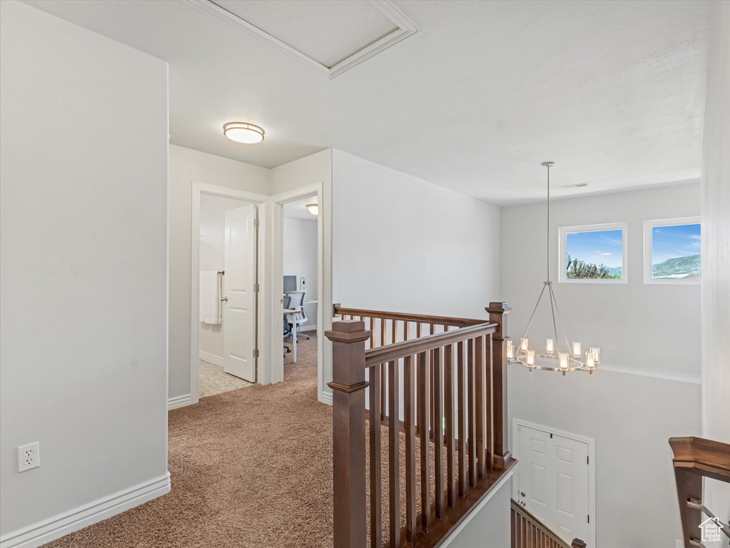 Hall with an upstairs landing and carpet