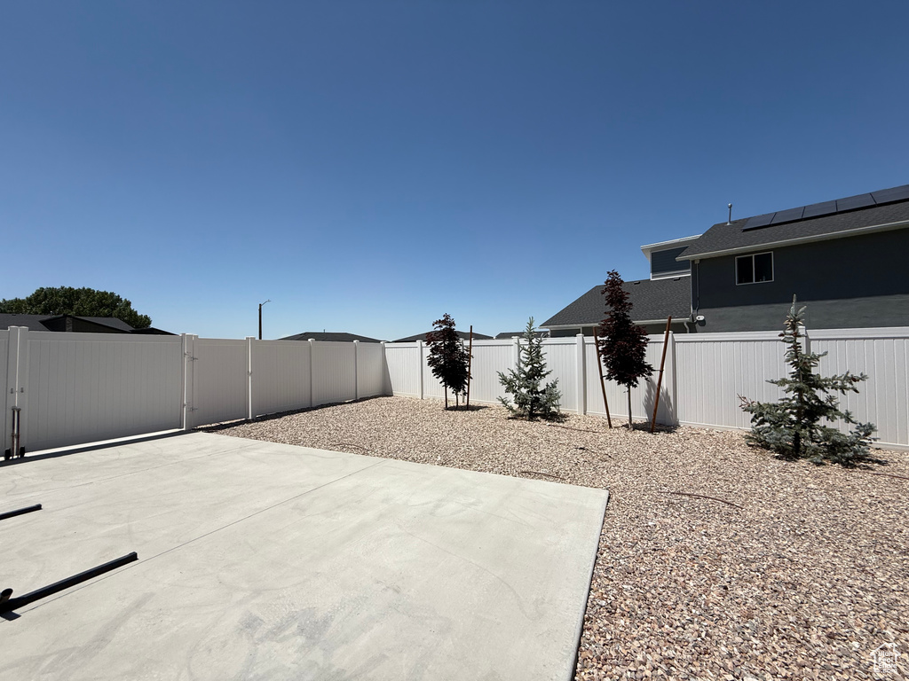 Fenced backyard with a patio