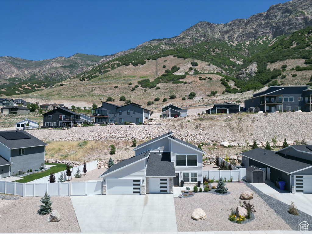View of mountain backdrop featuring nearby suburban area