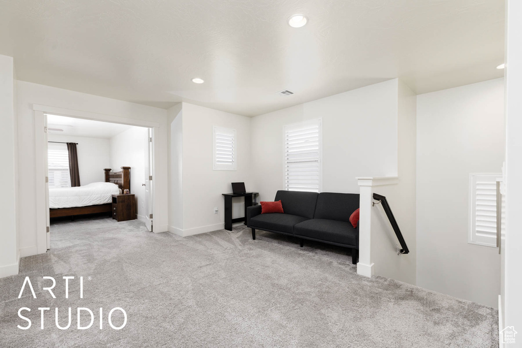 Sitting room featuring carpet floors and recessed lighting