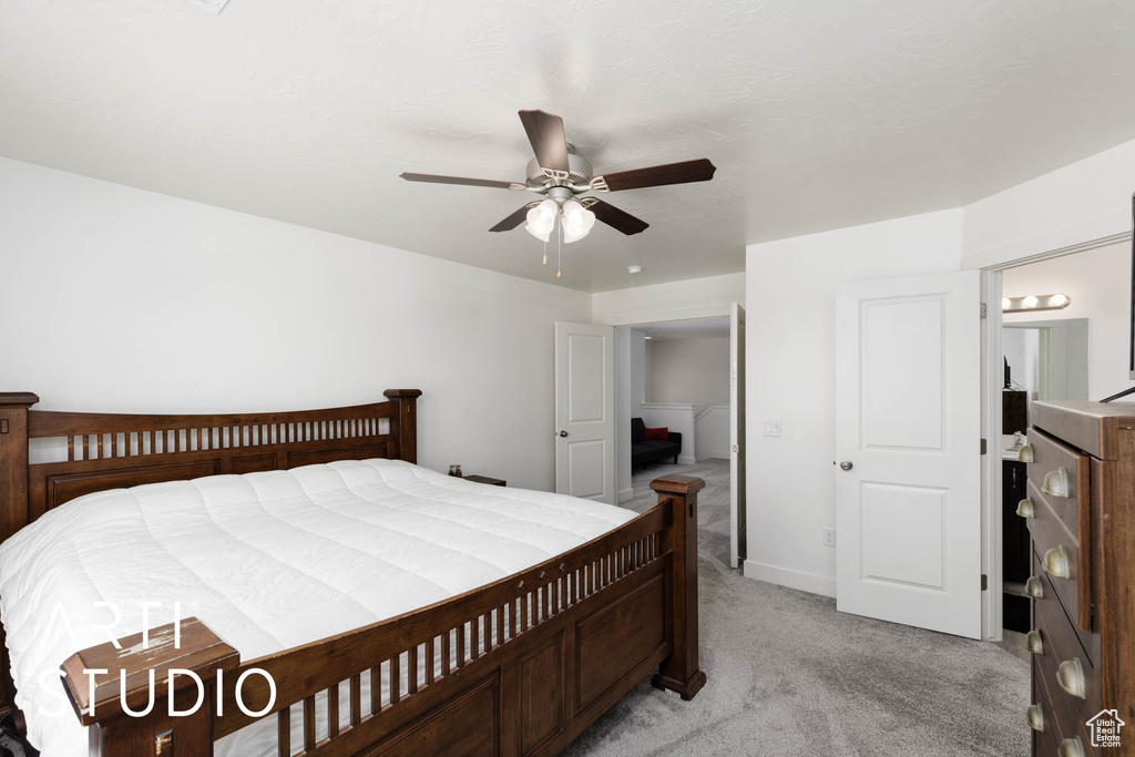 Bedroom featuring light colored carpet and ceiling fan
