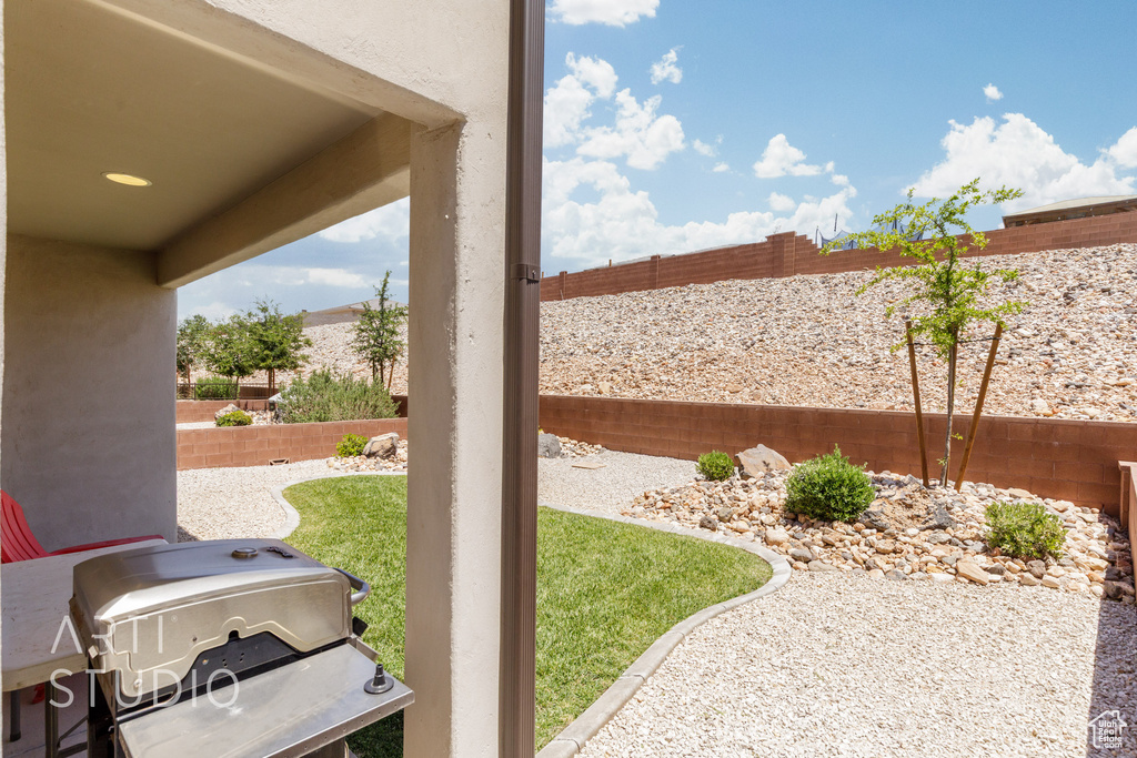 Fenced backyard featuring a patio