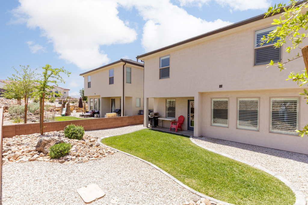 Back of house featuring a patio area and stucco siding