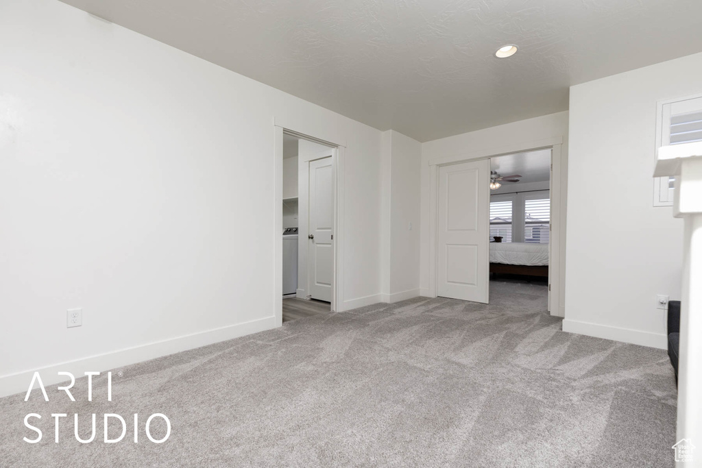 Spare room with carpet floors and a ceiling fan