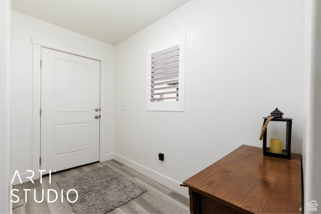 Entryway featuring light wood-type flooring and baseboards