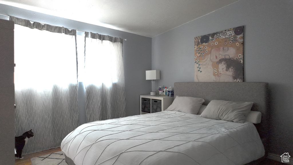 Bedroom with wood finished floors