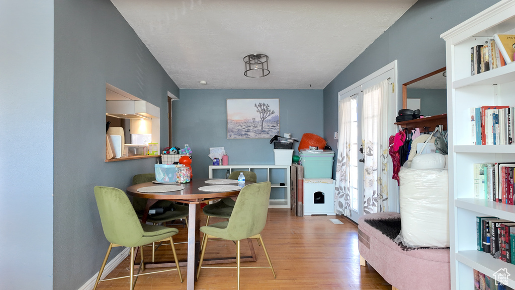Dining area with wood finished floors