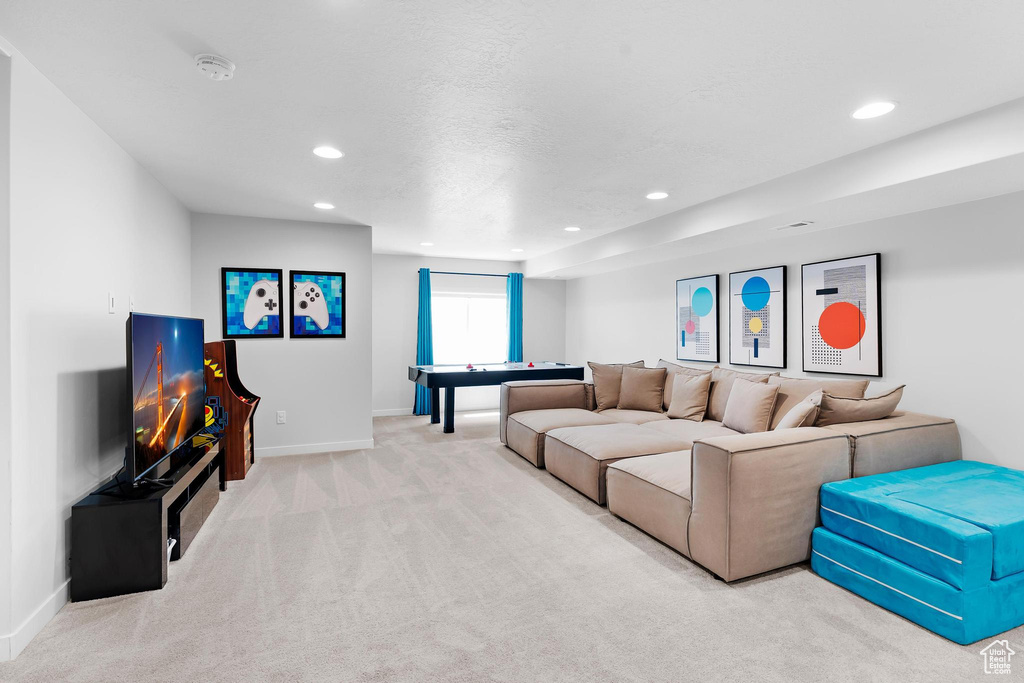 Living area featuring carpet floors and recessed lighting