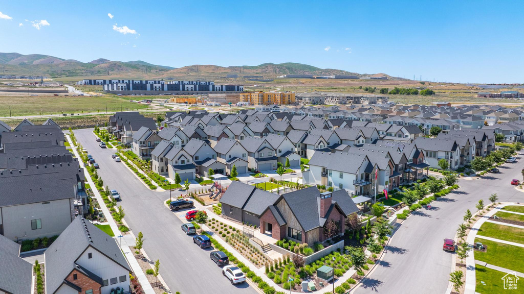 Aerial view of residential area featuring a mountain backdrop
