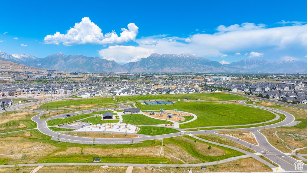 Aerial view of residential area featuring a mountainous background