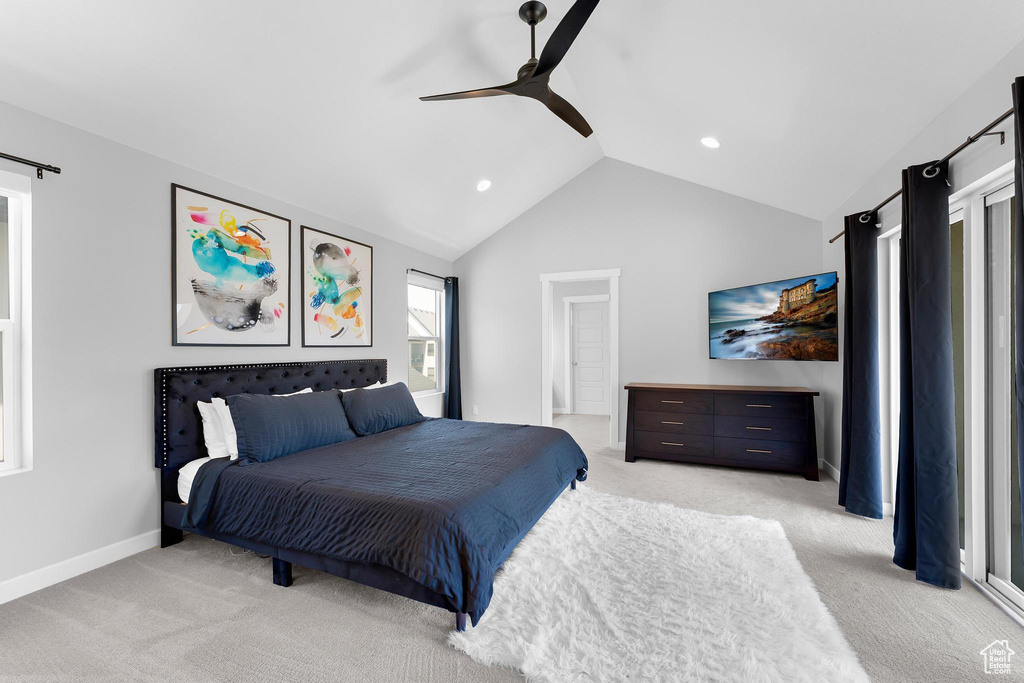Bedroom with light colored carpet, lofted ceiling, ceiling fan, and recessed lighting
