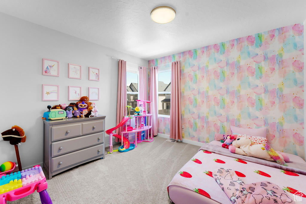 Carpeted bedroom with baseboards