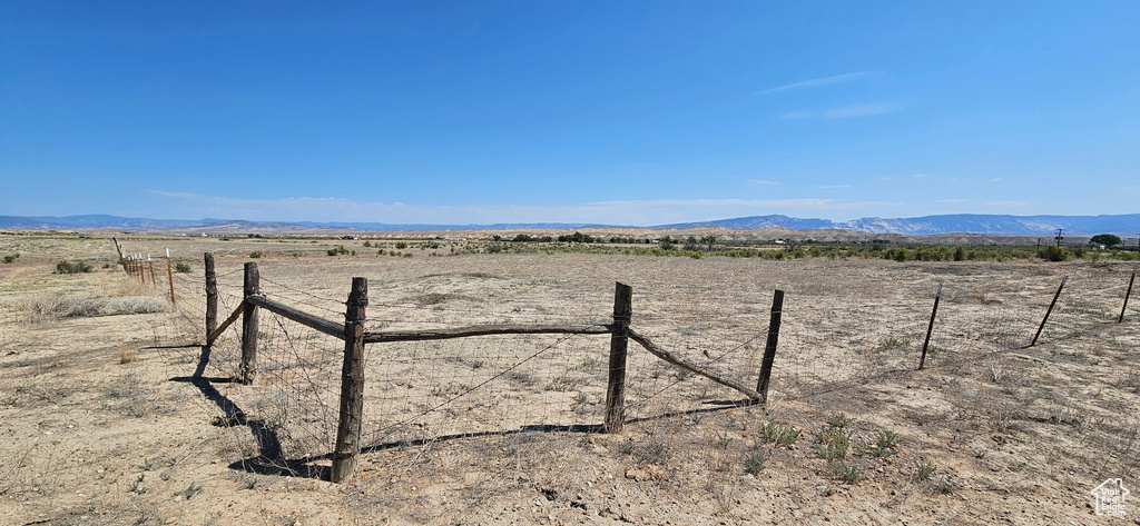 View of yard featuring a view of rural / pastoral area and a mountain view