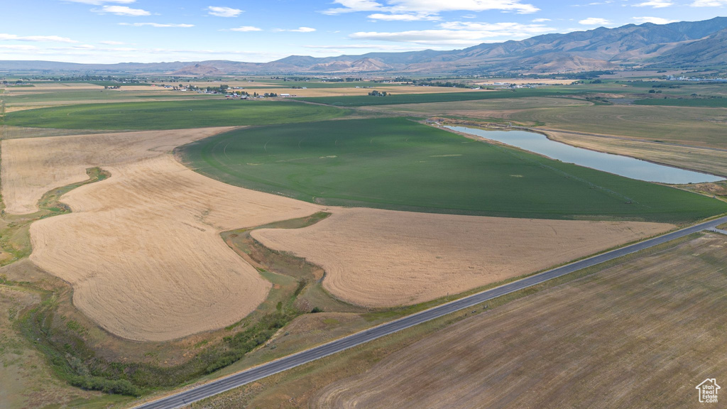 Bird's eye view of a water and mountain view and a golf course