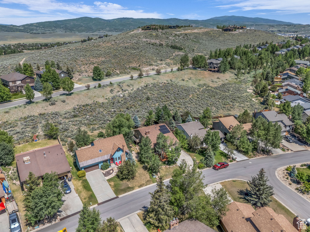 Aerial view of property's location with nearby suburban area