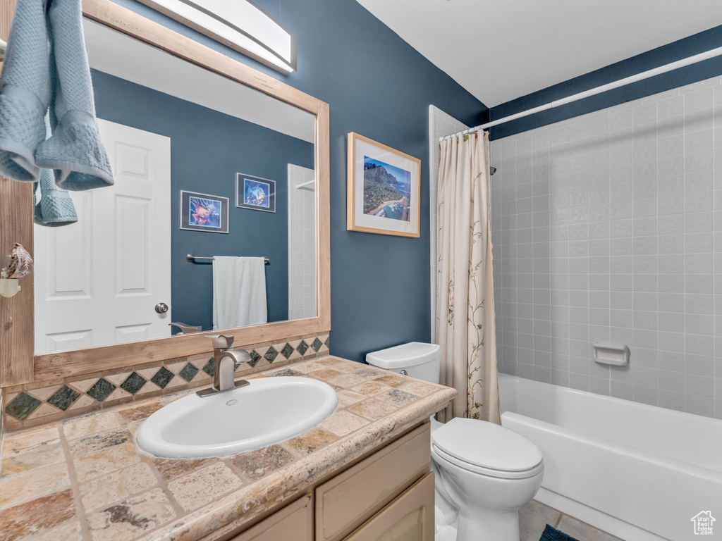 Full bathroom with vanity and shower / bath combo