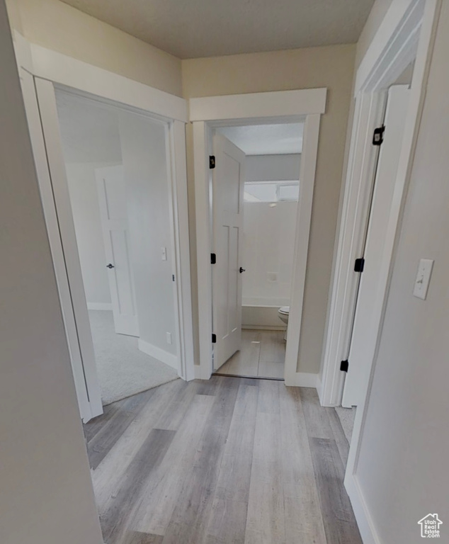 Hall with light wood-style floors