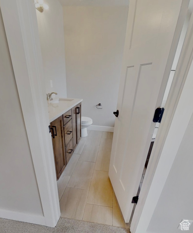 Bathroom with vanity and tile patterned flooring