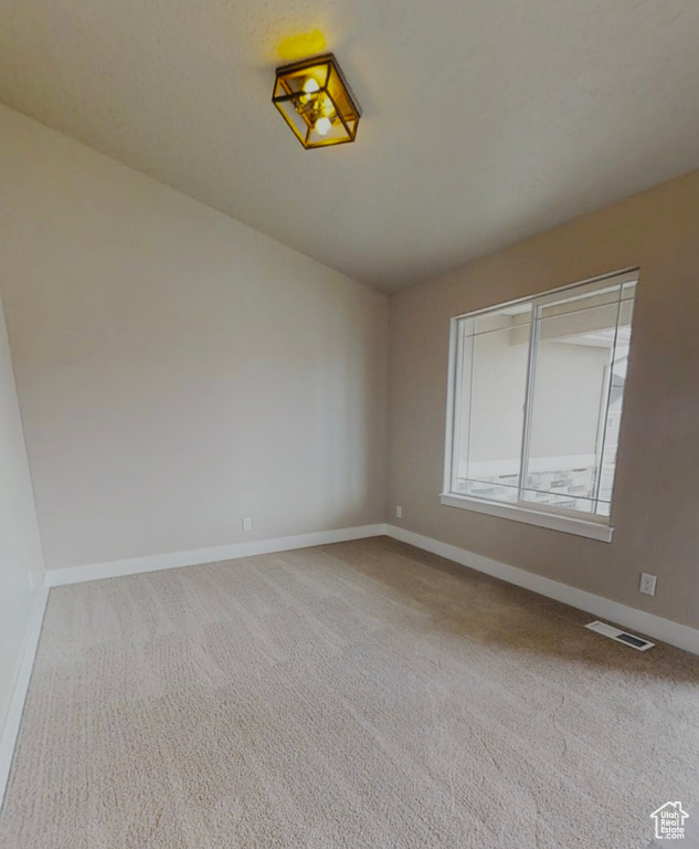 Unfurnished room featuring carpet flooring