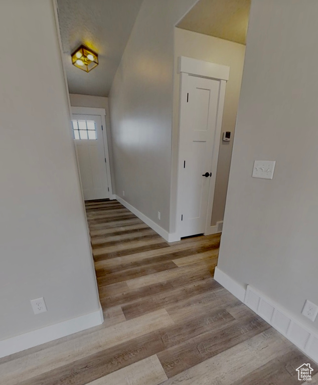 Corridor with wood finished floors