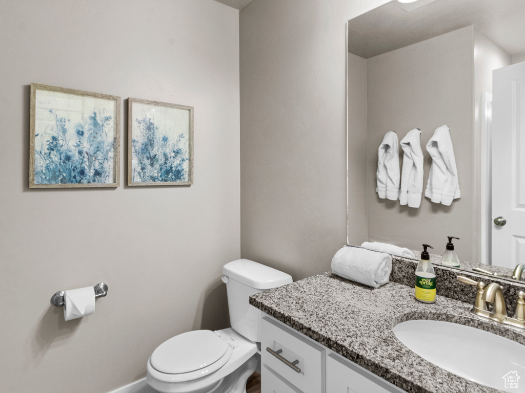 Bathroom featuring vanity and toilet