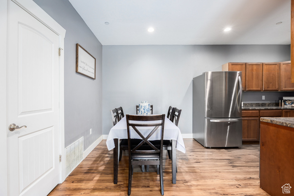 Dining room featuring light wood-style floors and recessed lighting