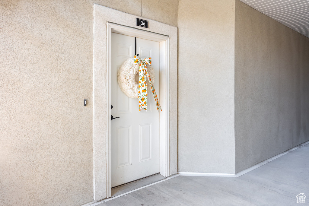 Property entrance with stucco siding