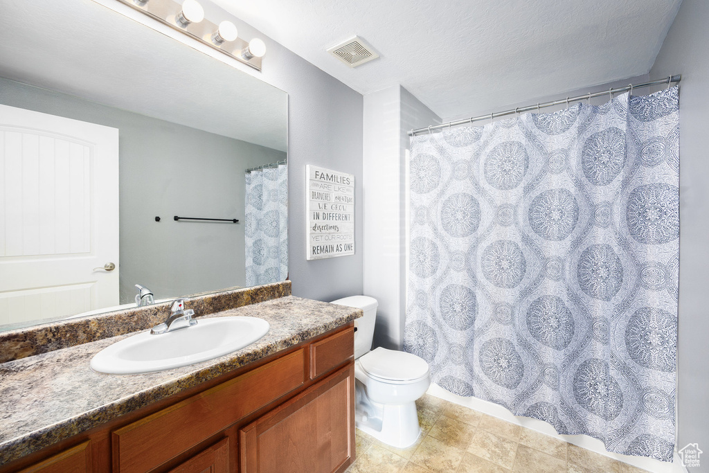Bathroom with vanity and toilet