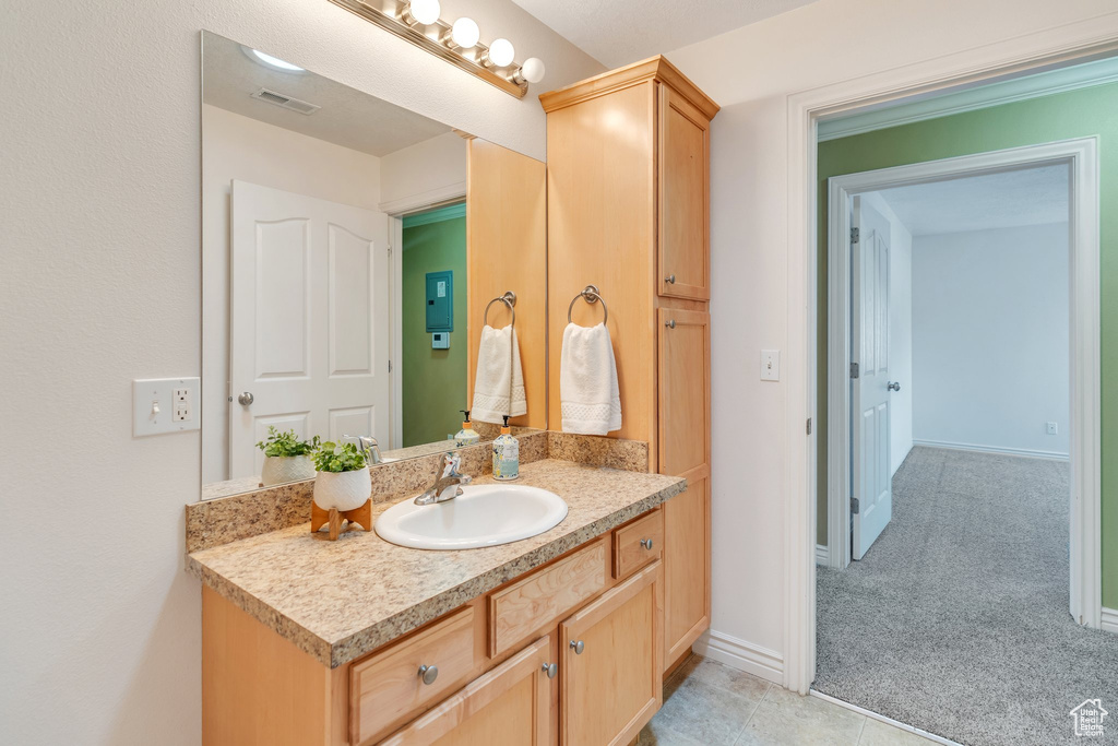 Bathroom with vanity and baseboards