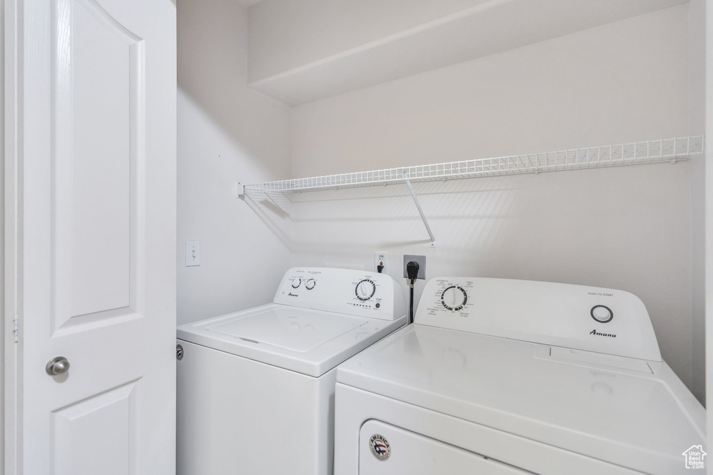 Laundry area with washing machine and clothes dryer