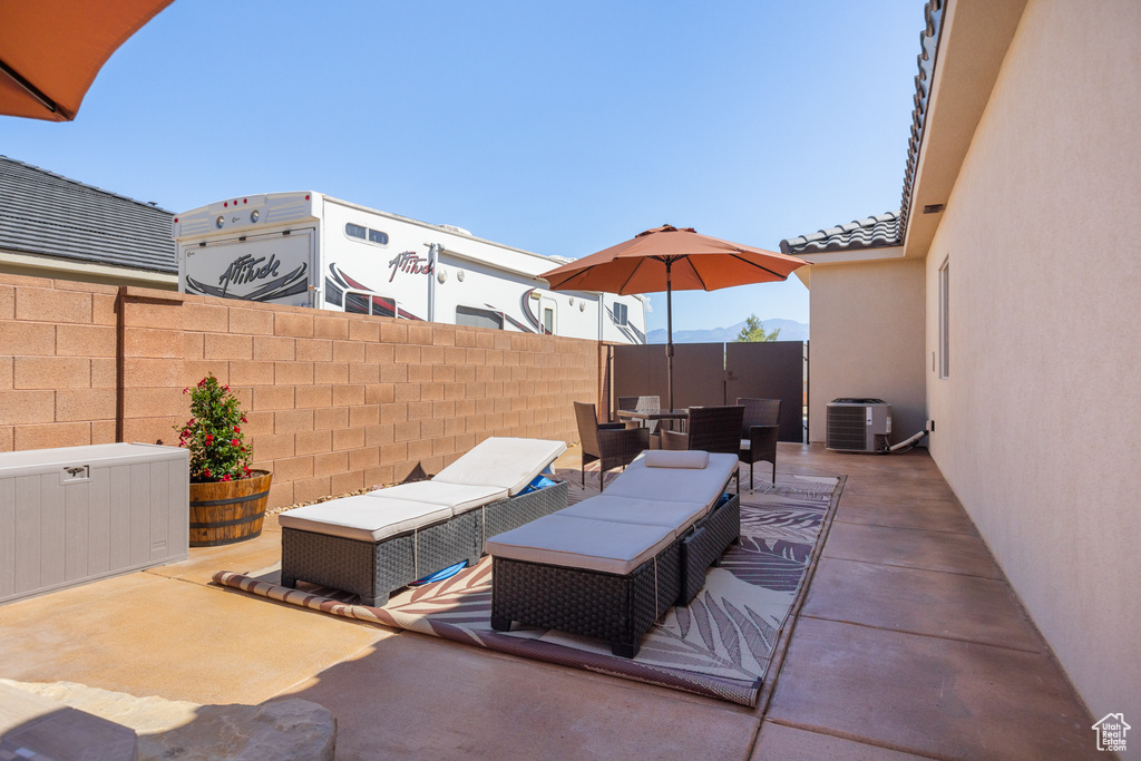 View of patio / terrace featuring an outdoor living space and a mountain view