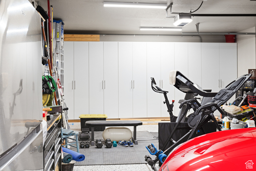 Garage featuring a garage door opener