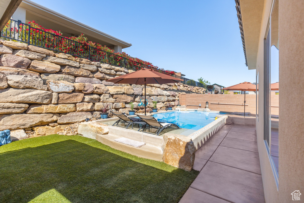 View of swimming pool featuring a patio