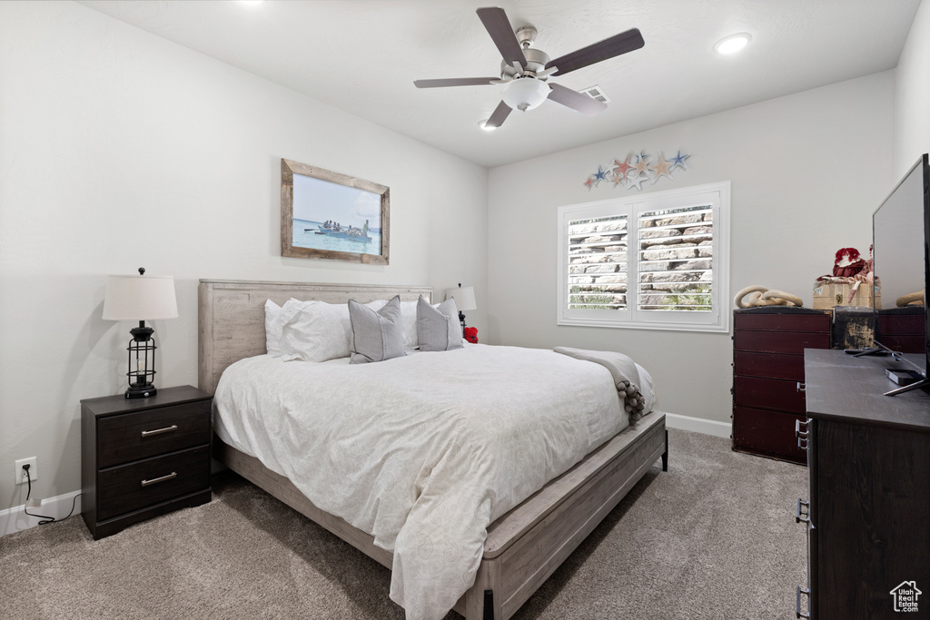 Bedroom featuring light carpet, recessed lighting, and ceiling fan