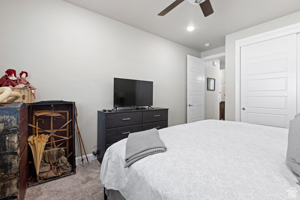 Bedroom featuring carpet and ceiling fan